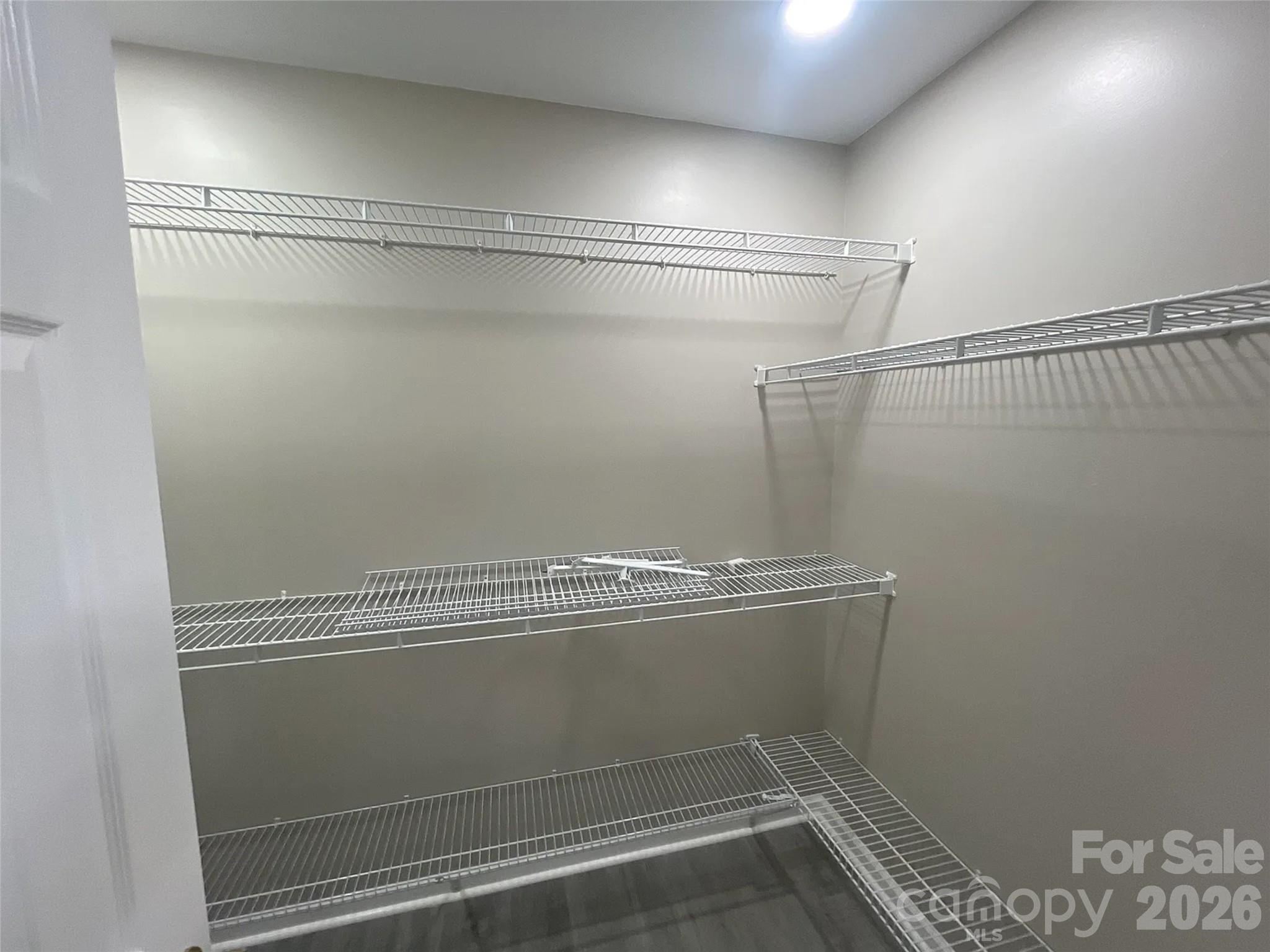 12042 Mallard Ridge Drive Charlotte, NC 28269 - Photo 13 of 20 a view of a room with racks on the wall