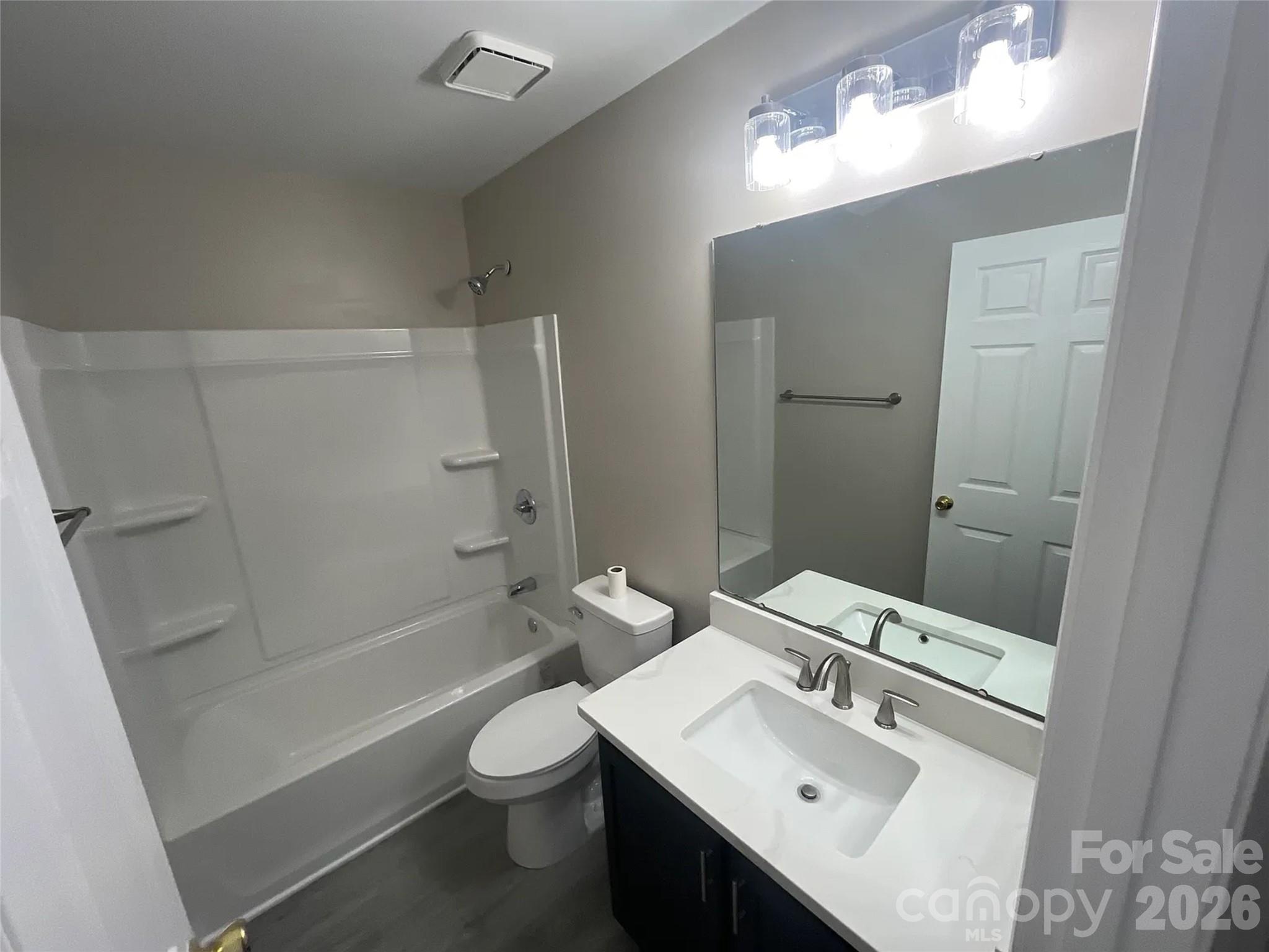 12042 Mallard Ridge Drive Charlotte, NC 28269 - Photo 17 of 20 a bathroom with a sink a toilet and shower