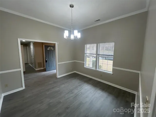 a view of livingroom with window hardwood floor and ceiling fan
