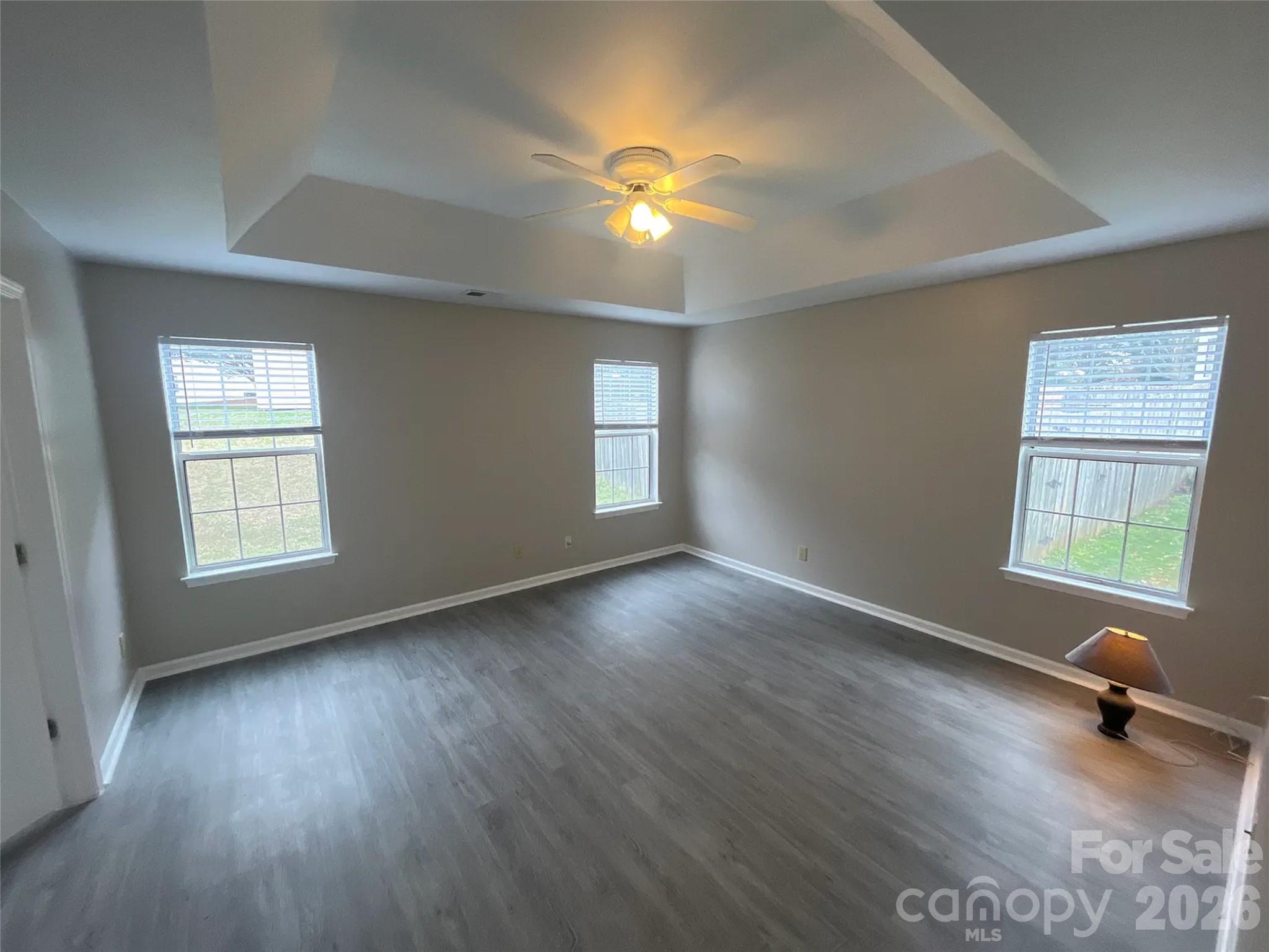 12042 Mallard Ridge Drive Charlotte, NC 28269 - Photo 9 of 20 a view of empty room with wooden floor and fan