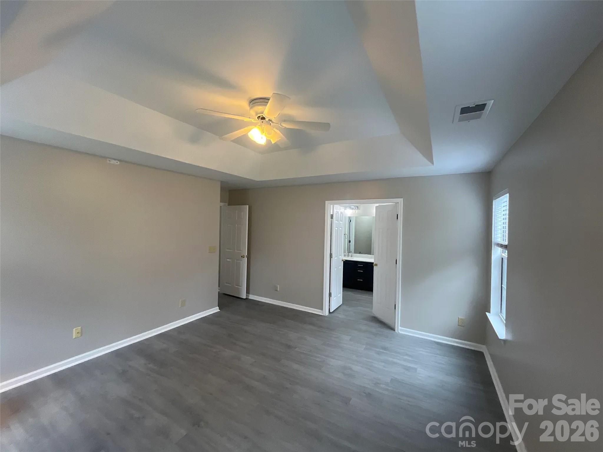 12042 Mallard Ridge Drive Charlotte, NC 28269 - Photo 10 of 20 an empty room with windows and fireplace