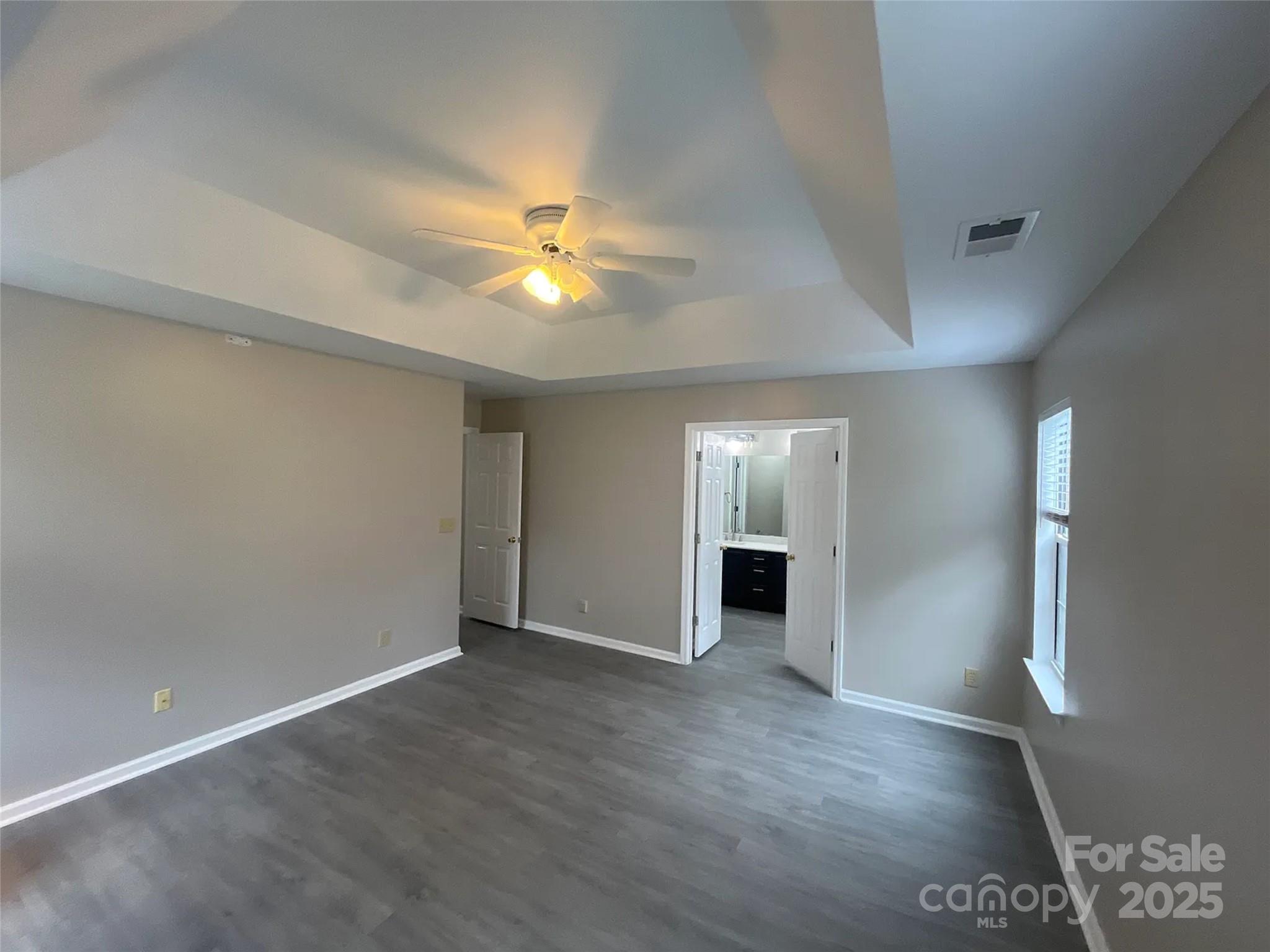 12042 Mallard Ridge Drive Charlotte, NC 28269 - Photo 10 of 19 an empty room with windows and fireplace