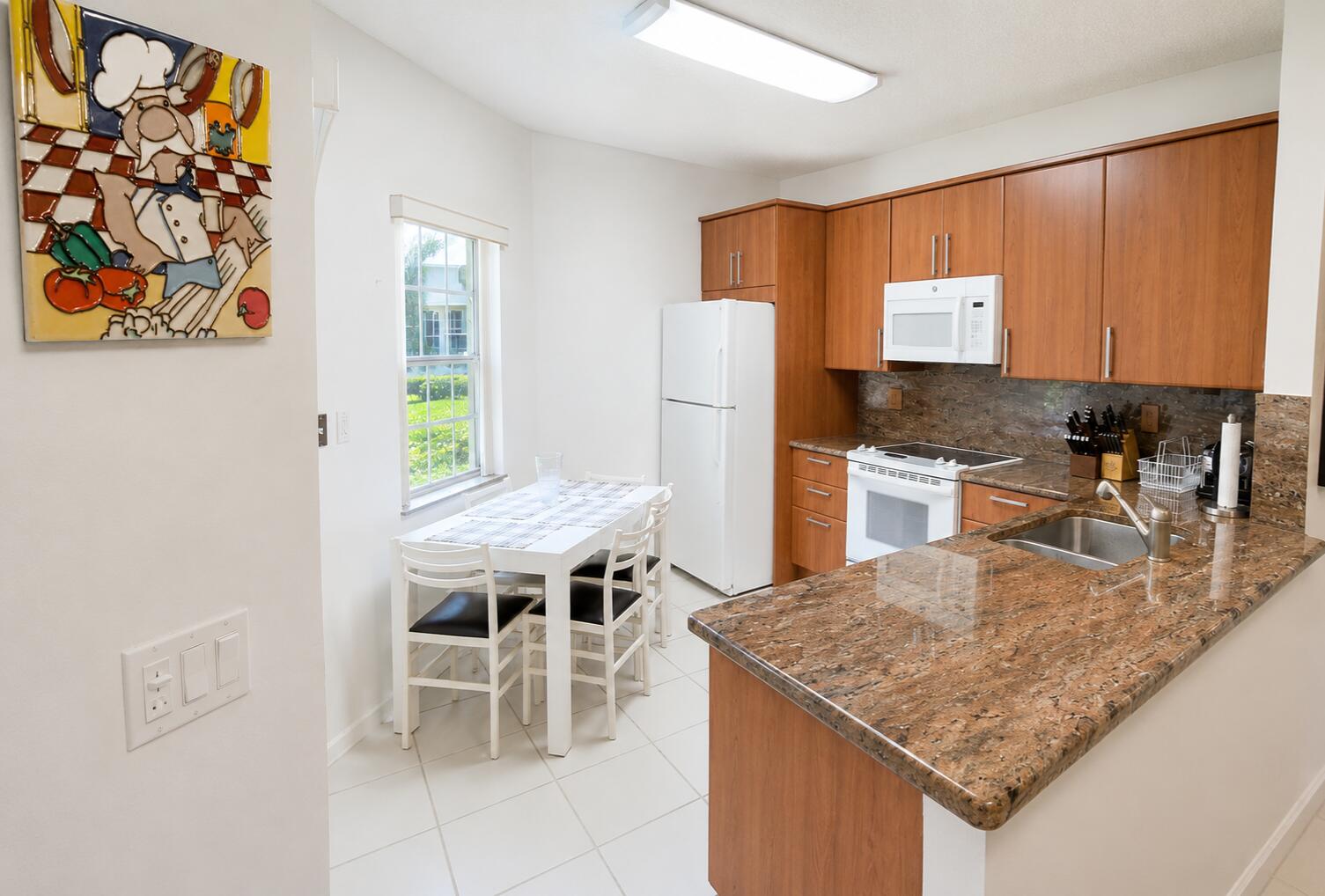 6566 Via Regina, Unit 6566 Boca Raton, FL 33433 - Photo 5 of 17 Granite bar, eat in area & window