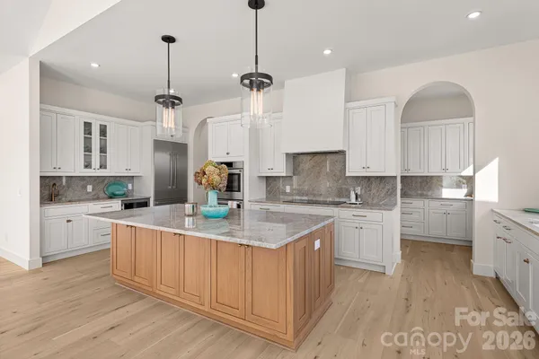 a kitchen with white cabinets
