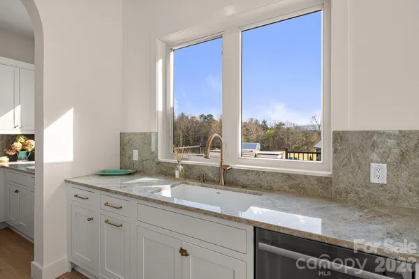a bathroom with a tub shower and sink