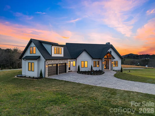 a view of a kitchen with furniture and a floor to ceiling window