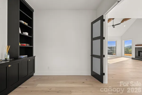 a view of an empty room with a window