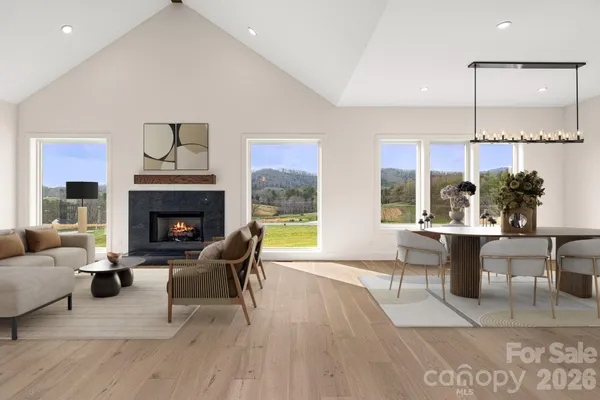 a kitchen with granite countertop stainless steel appliances a refrigerator and cabinets