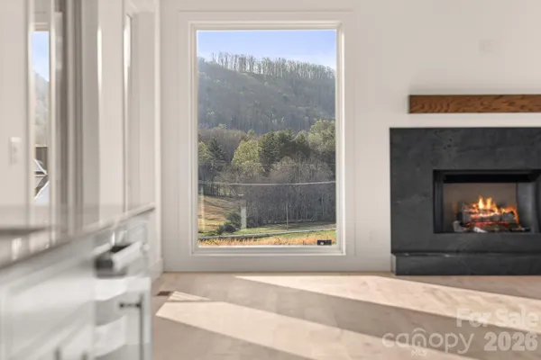 a large kitchen with stainless steel appliances kitchen island granite countertop a sink and cabinets