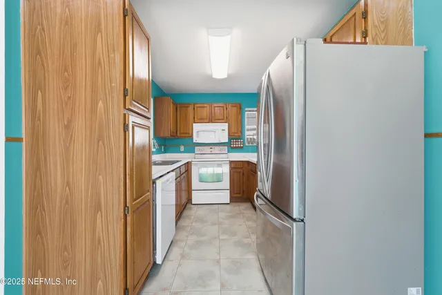 a spacious bedroom with a large bed and a window