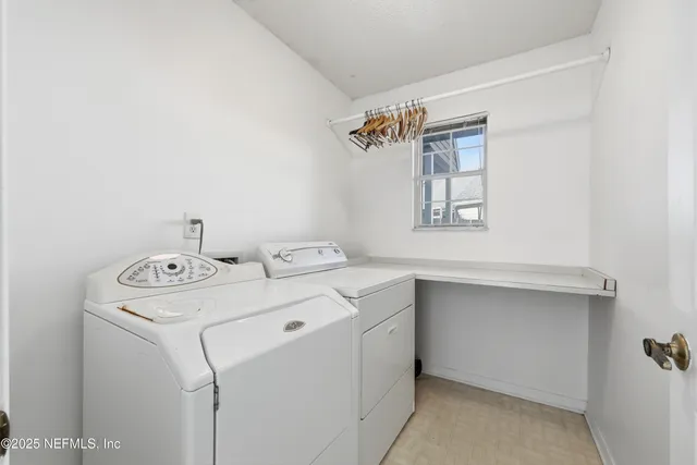 an aerial view of a house with a ocean view