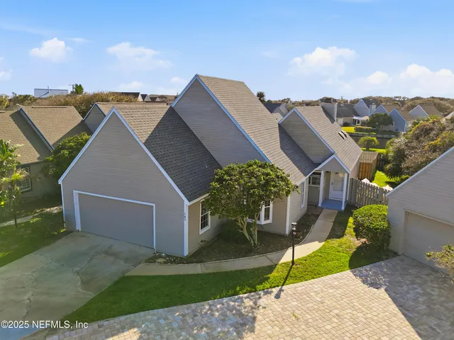 an aerial view of a swimming pool and outdoor seating