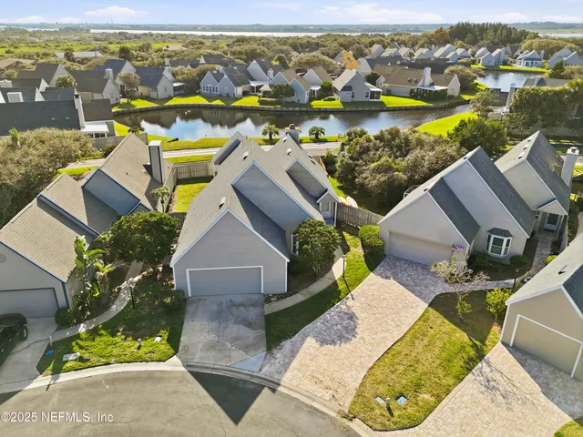a sign of golf club on a wall under a building