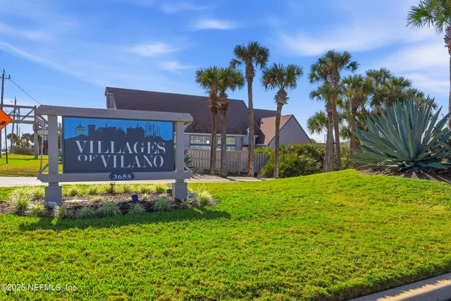 a view of a swimming pool with a table and chairs