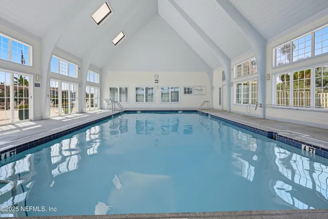a view of swimming pool with seating area
