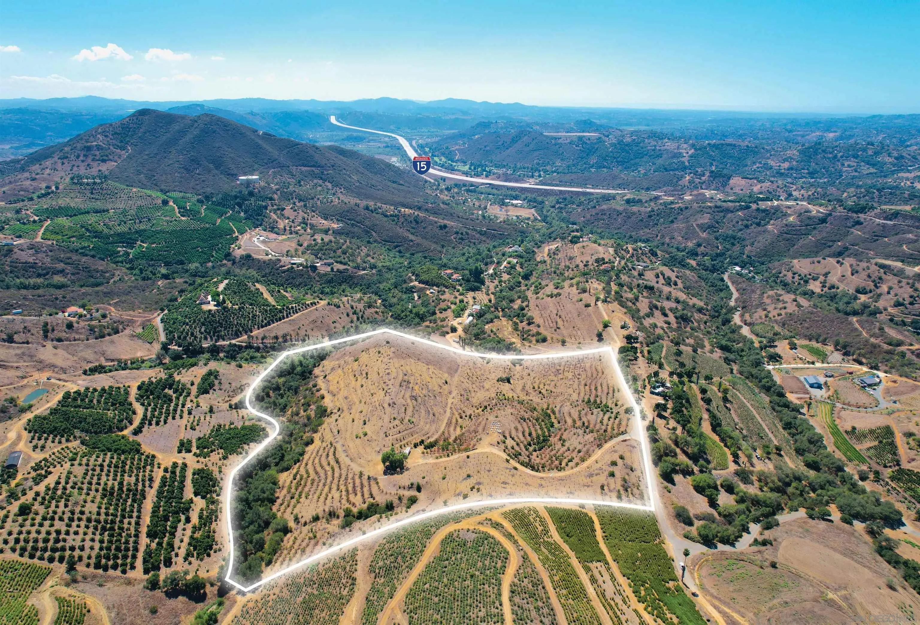Along Along Ordway Road Fallbrook, CA 92028 - Photo 3 of 3 an aerial view of a house with yard and mountain view in back