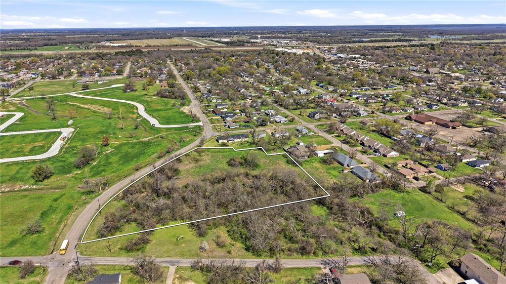 1700 Agnew Street Bonham, TX 75418 - Photo 5 of 14 an aerial view of a residential houses with outdoor space and trees