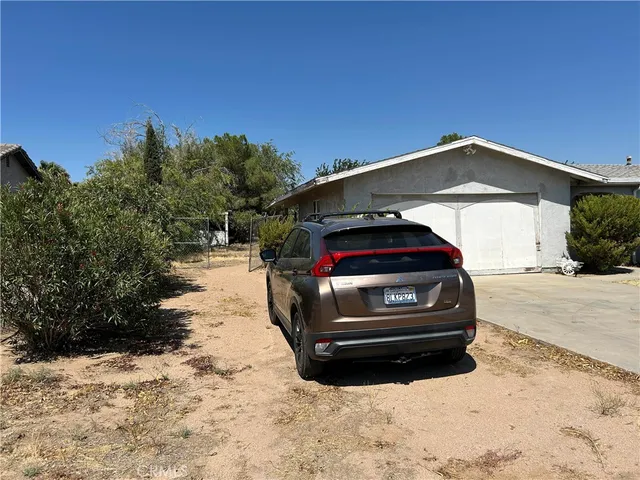 a car parked in front of a house