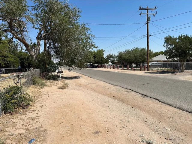a view of a road with a building in the background