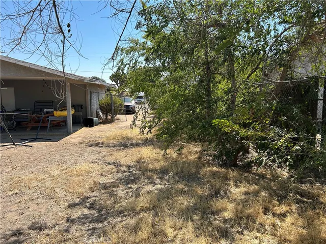 a view of a backyard of the house