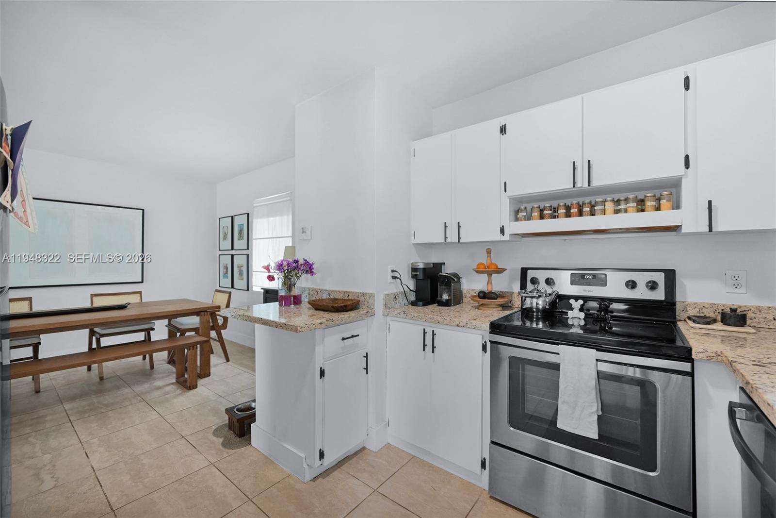 8780 Southwest 200th Terrace Cutler Bay, FL 33189 - Photo 15 of 39 a kitchen with stainless steel appliances a stove a sink and cabinets
