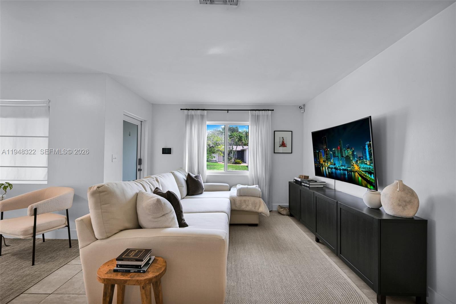 8780 Southwest 200th Terrace Cutler Bay, FL 33189 - Photo 8 of 39 a living room with furniture and a flat screen tv