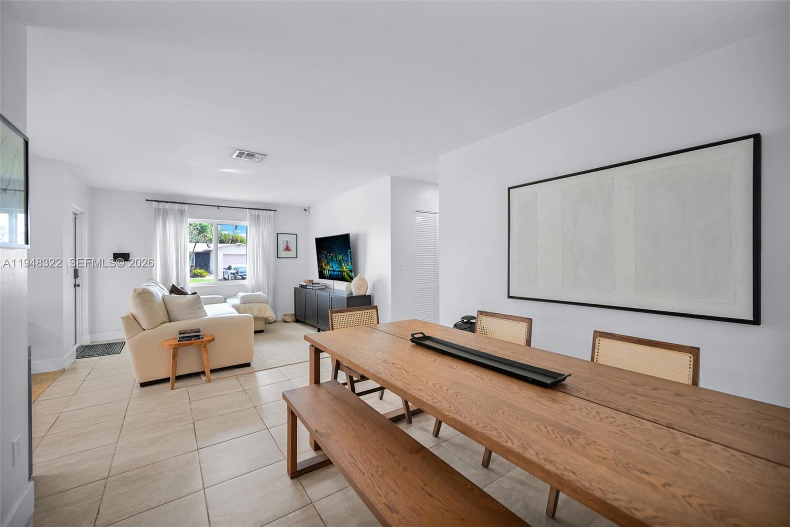 8780 Southwest 200th Terrace Cutler Bay, FL 33189 - Photo 10 of 39 a living room with furniture and a flat screen tv