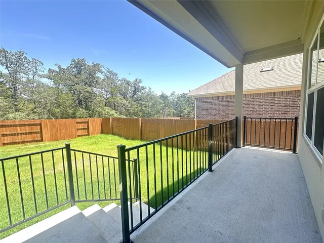 a view of a balcony with an outdoor space