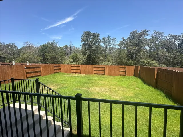 a view of a garden from a balcony