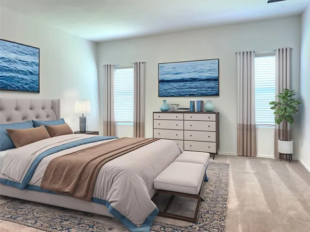 a bedroom with a bed and dresser