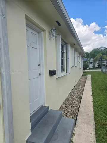 a balcony with wooden floor and fence