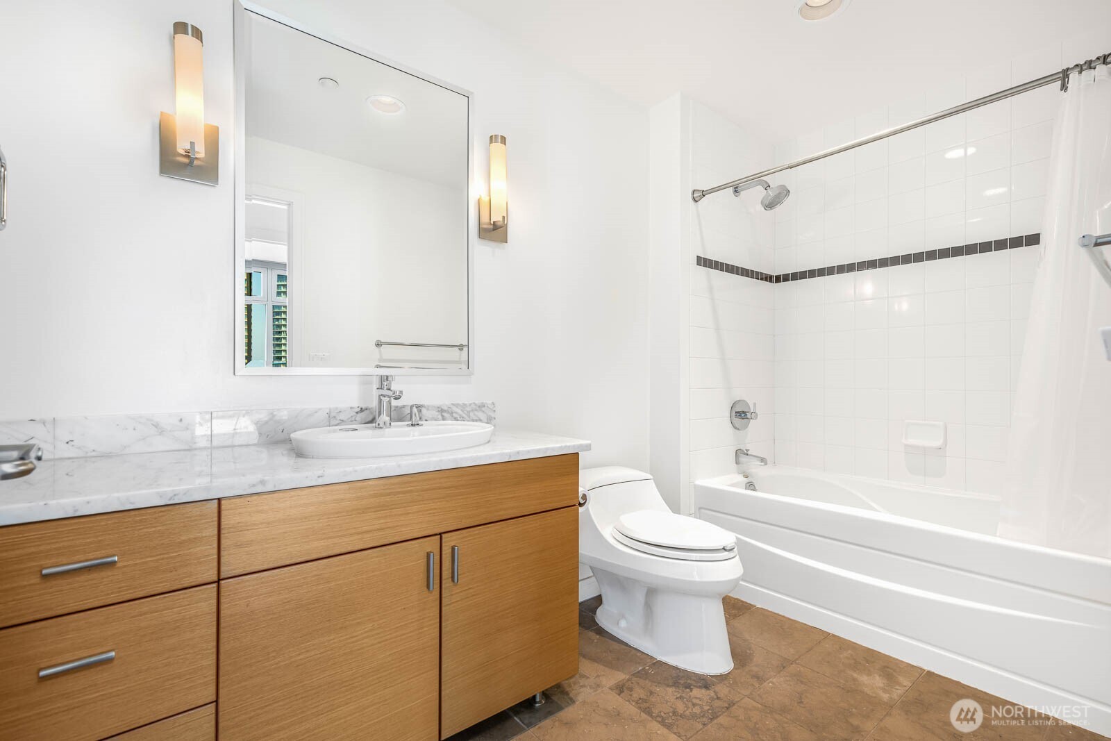 819 Virginia Street, Unit 3303 Seattle, WA 98101 - Photo 15 of 29 a bathroom with a granite countertop sink toilet and shower