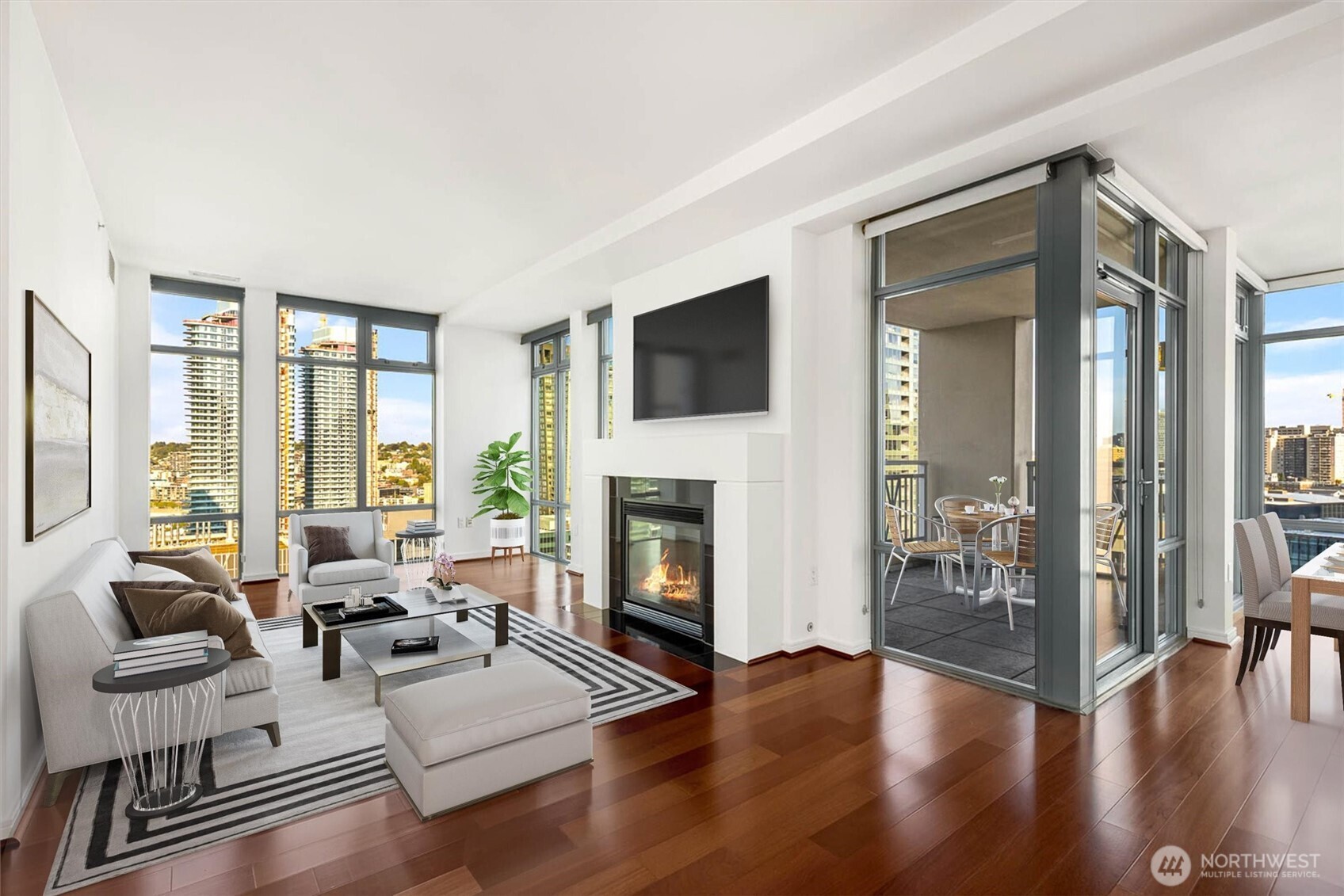 819 Virginia Street, Unit 3303 Seattle, WA 98101 - Photo 6 of 29 a living room with furniture large window and a fireplace