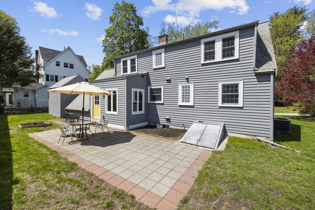 15 Dee Road Lexington, MA 02420 - Photo 30 of 34 a view of a house with backyard and sitting area