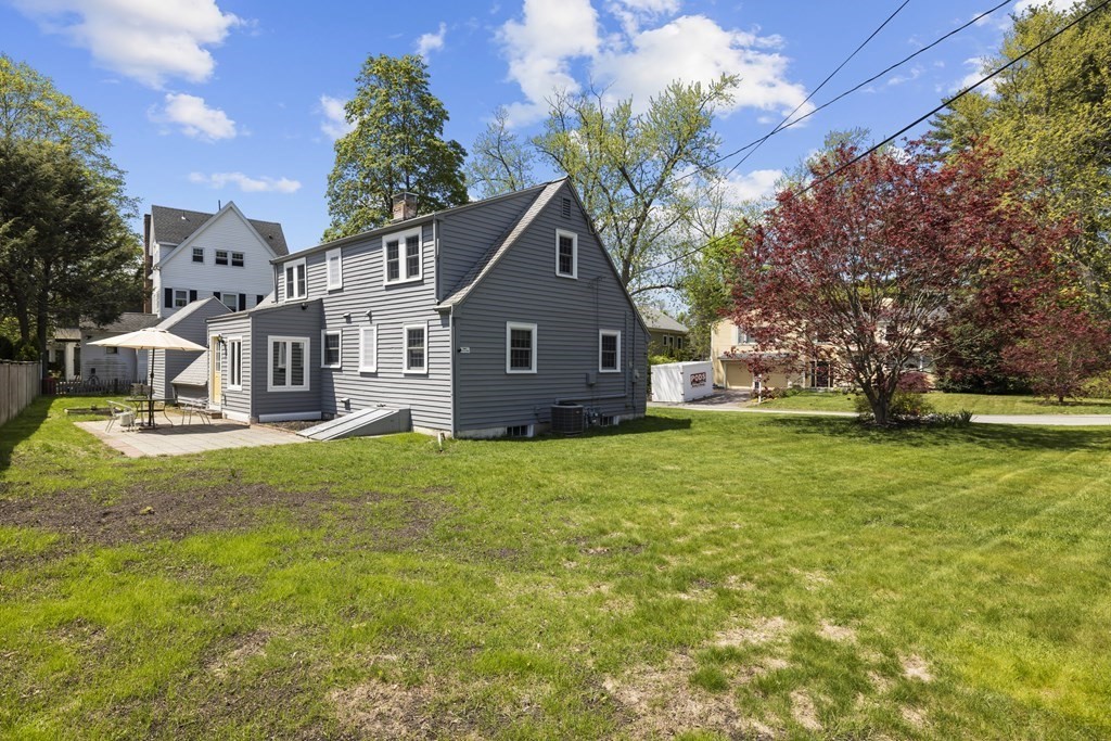 15 Dee Road Lexington, MA 02420 - Photo 31 of 34 a front view of a house with a garden and yard