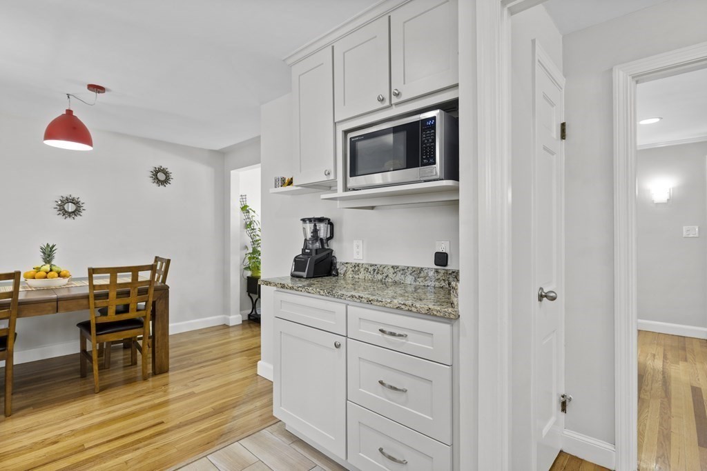 15 Dee Road Lexington, MA 02420 - Photo 5 of 34 a kitchen with a microwave and cabinets