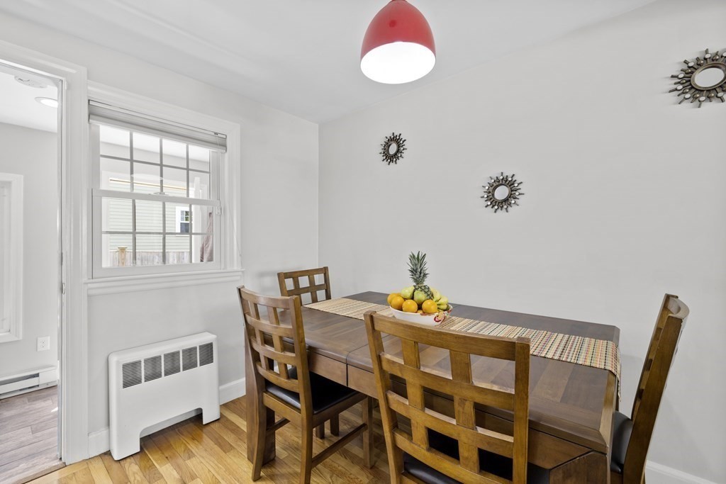 15 Dee Road Lexington, MA 02420 - Photo 8 of 34 a view of a dining room with furniture and wooden floor