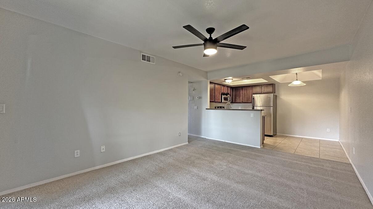1720 East Thunderbird Road, Unit 2095 Phoenix, AZ 85022 - Photo 15 of 22 a view of a kitchen with a sink and stainless steel appliances