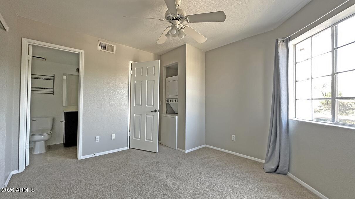 1720 East Thunderbird Road, Unit 2095 Phoenix, AZ 85022 - Photo 7 of 22 an empty room with windows and closet
