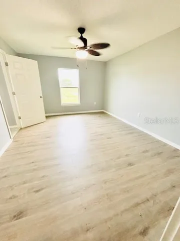 a bedroom with a bed and a mirror