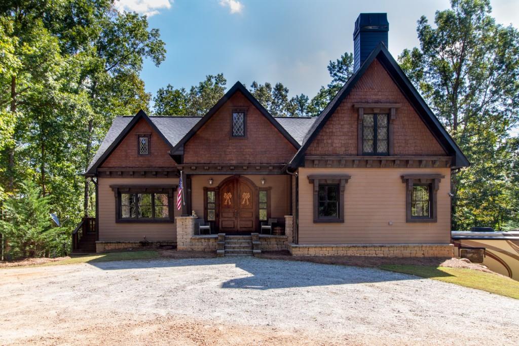 Tall gables with cedar shake cladding and leaded glass windows, rustic beams on beefy, ornamental corbels, a stone-framed entryway-these classic hallmarks of Tudor design put a welcoming face on this 3BR, 21/2 bath home on 18 acres just out of town.