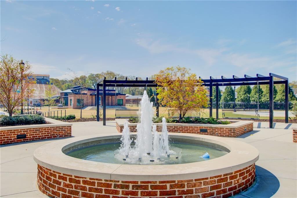411 Ash Street Monroe, GA 30655 - Photo 29 of 36 a view of a swimming pool with a patio