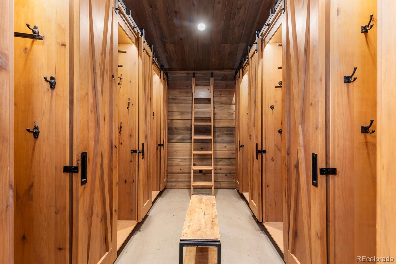 10013 McKinney Road Littleton, CO 80127 - Photo 12 of 50 a view of a hallway with wooden walls