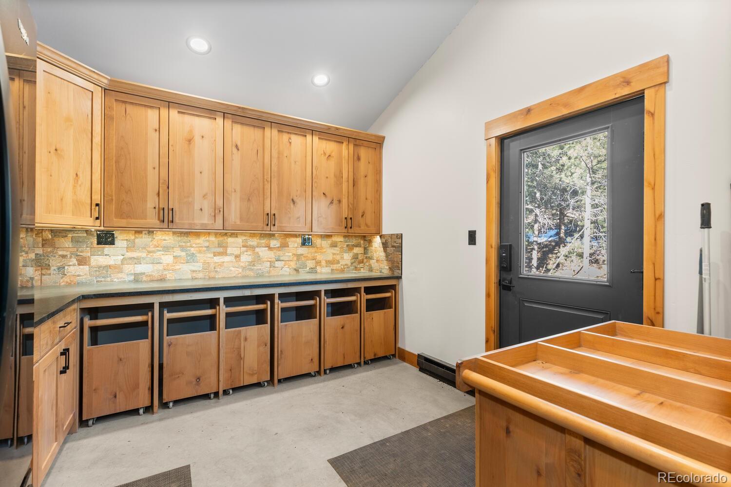 10013 McKinney Road Littleton, CO 80127 - Photo 13 of 50 a kitchen with stainless steel appliances granite countertop a stove and a refrigerator