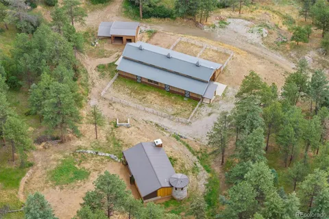 an aerial view of a house with a garden