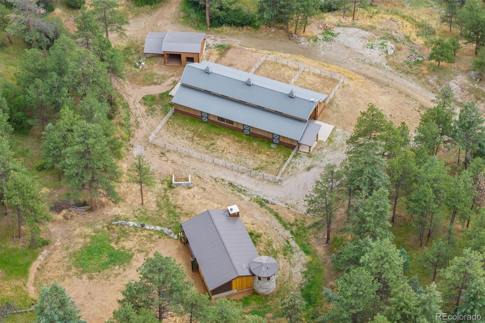 10013 McKinney Road Littleton, CO 80127 - Photo 2 of 50 an aerial view of a house with a garden