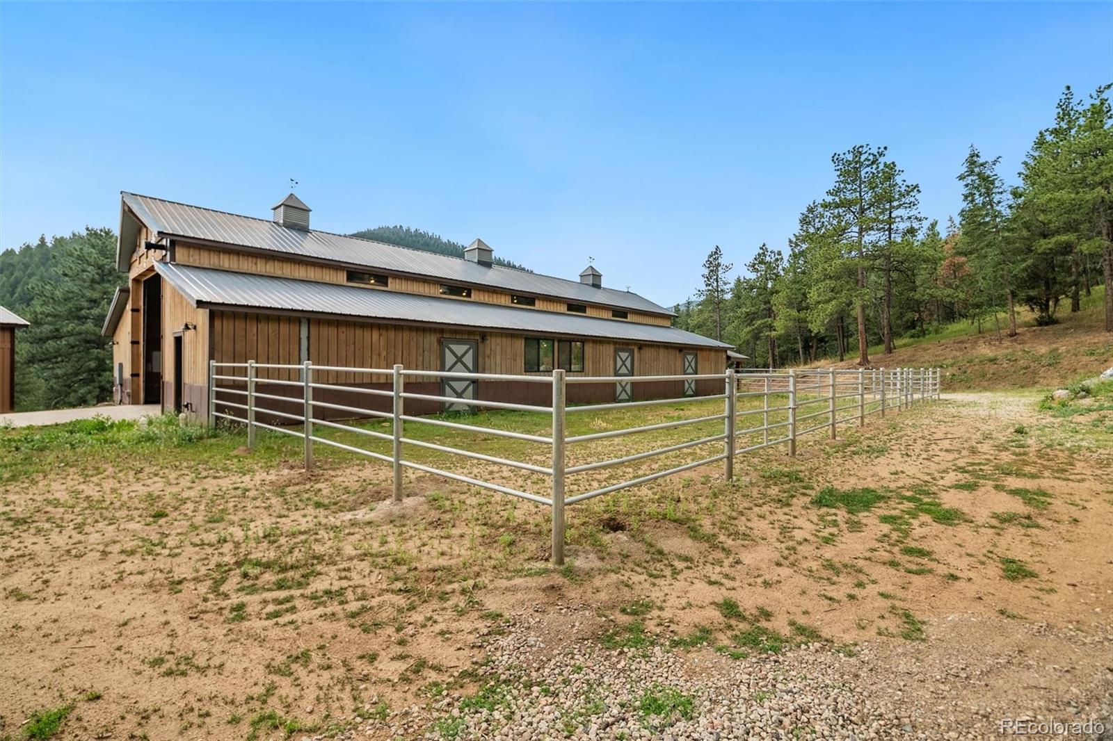 10013 McKinney Road Littleton, CO 80127 - Photo 21 of 50 a view of a house with a yard