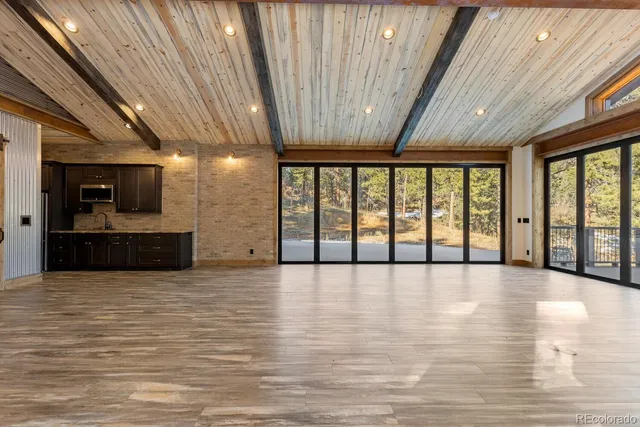 a view of an empty room with a flat screen tv