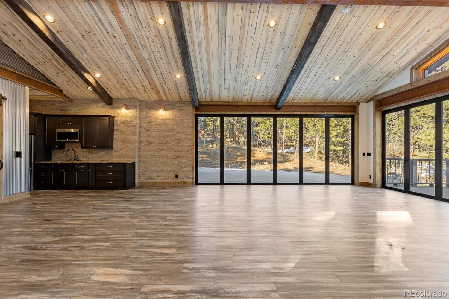 10013 McKinney Road Littleton, CO 80127 - Photo 29 of 50 a view of an empty room with a flat screen tv