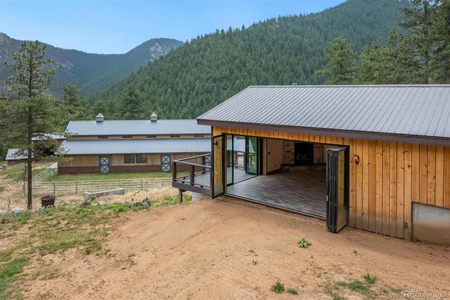 a view of a house with pool and a yard